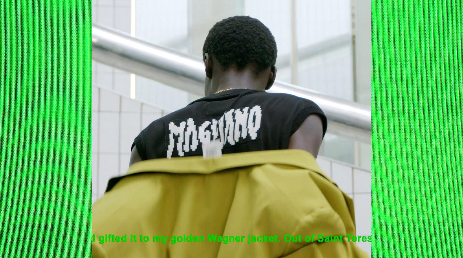 a man in a black shirt and yellow pants
