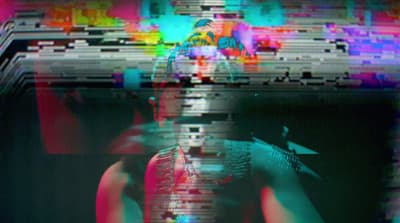a blurry image of a person with a cell phone