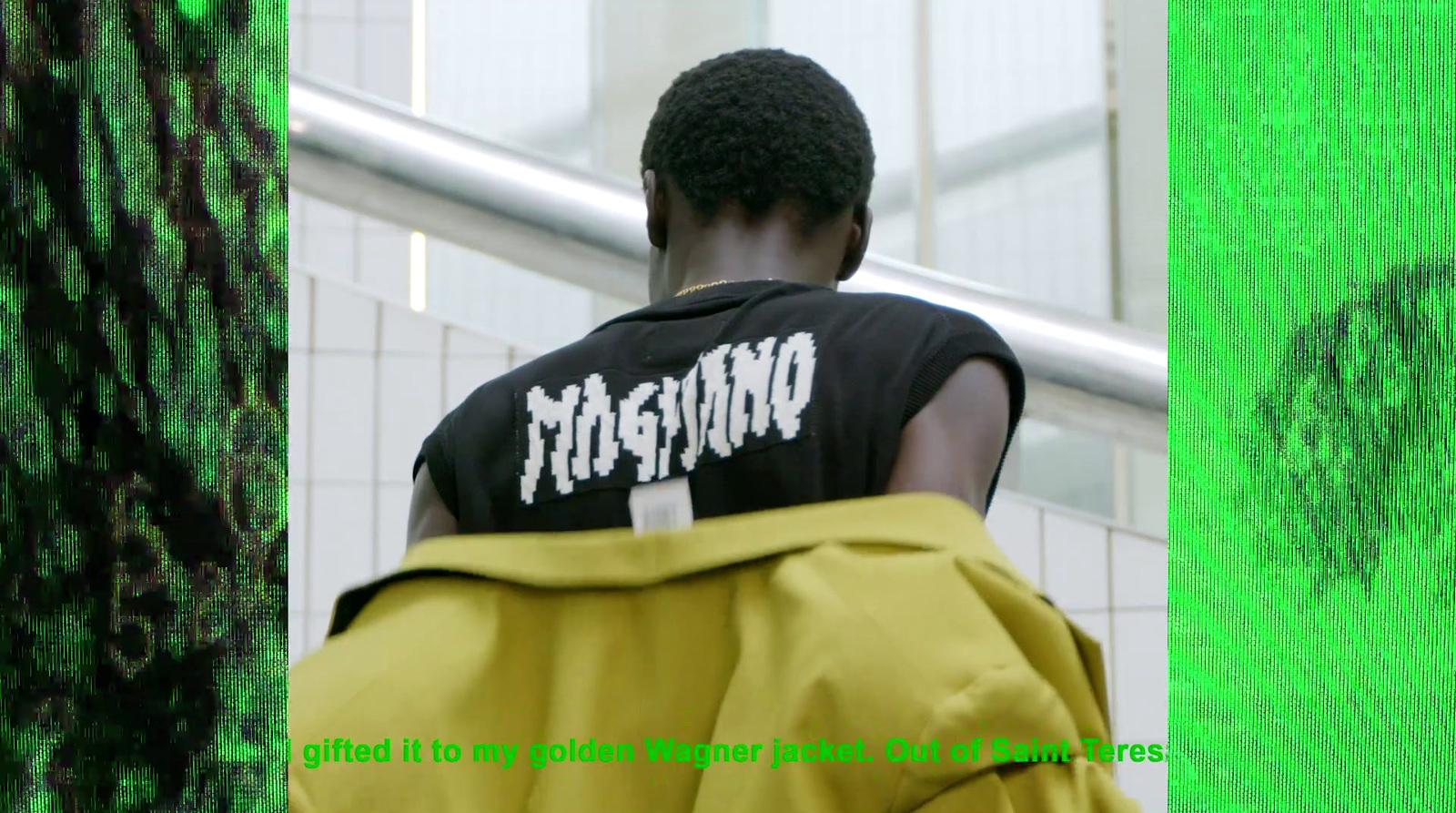 a man in a black shirt and a yellow bag