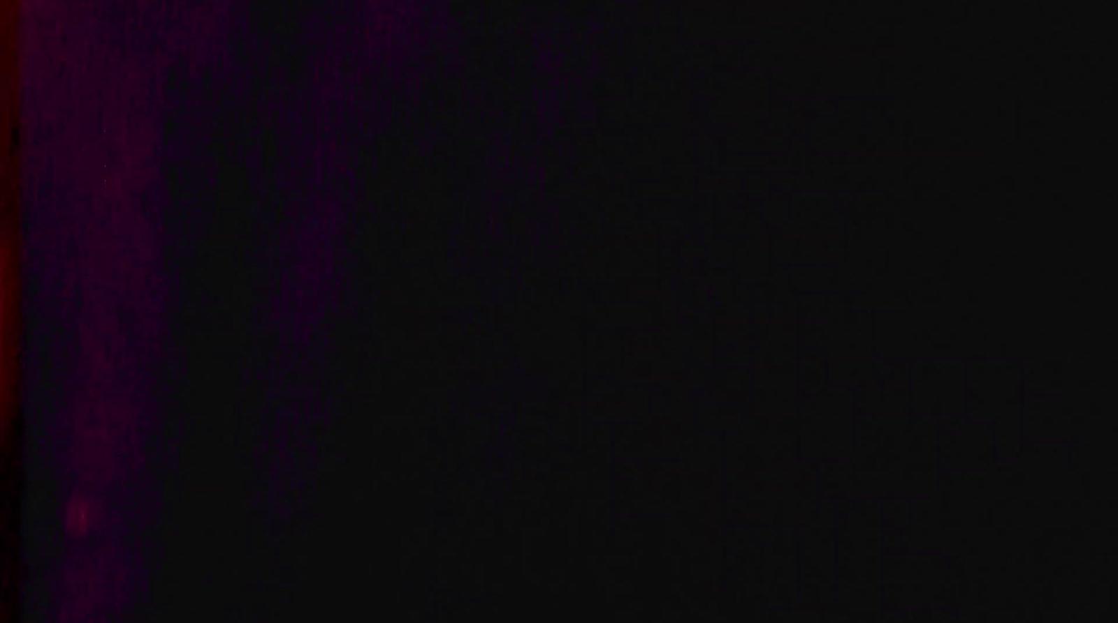 a black and red wall with a clock on it