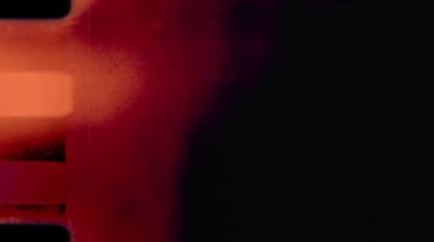 a blurry photo of a red and black wall