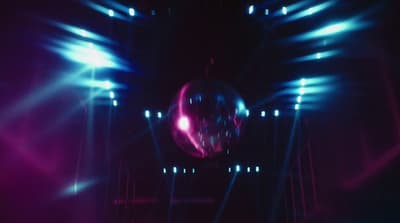 a disco ball in the middle of a stage