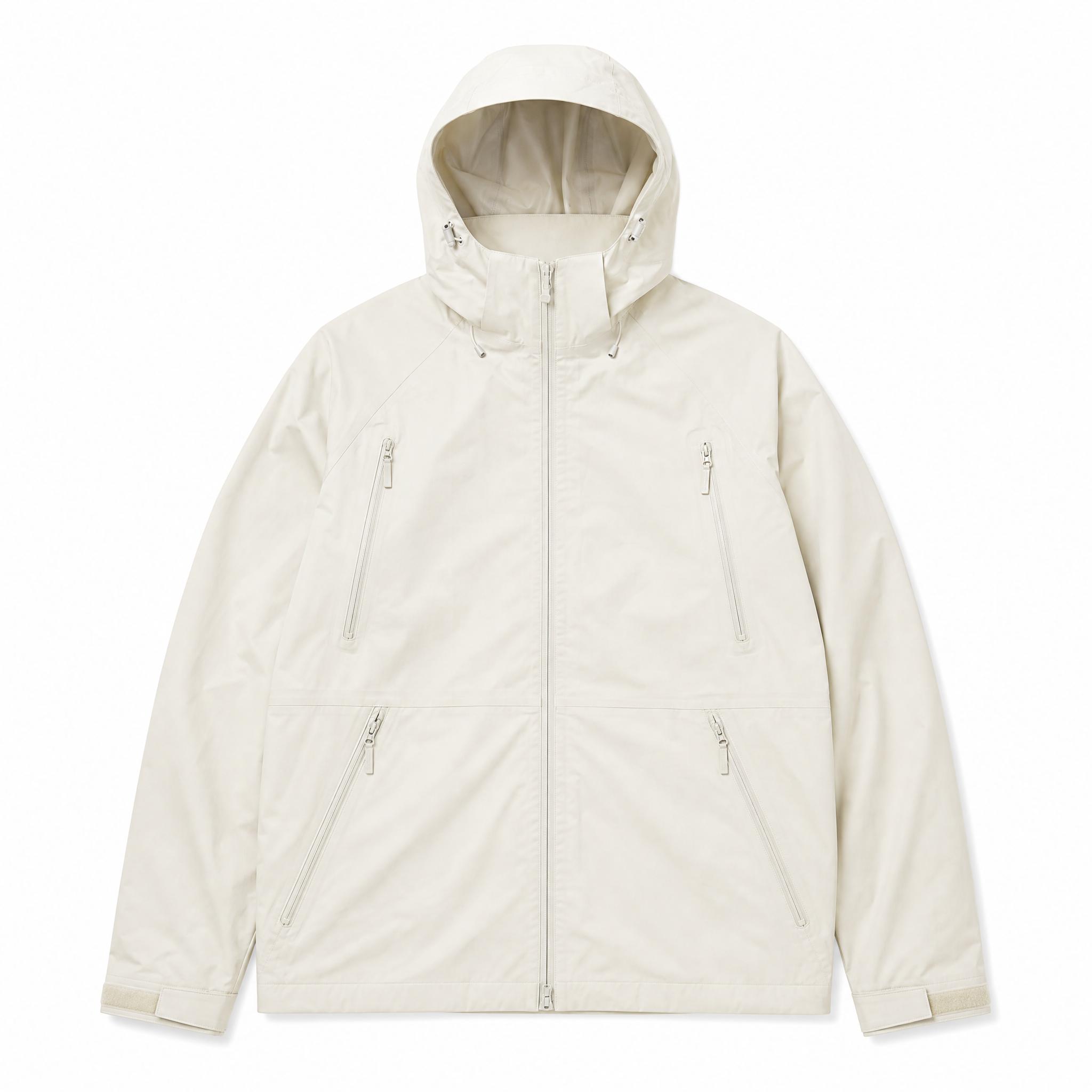 Cream hooded shell jacket laid flat, and the same jacket worn zipped by a man in dark trousers against a light gray backdrop - Before